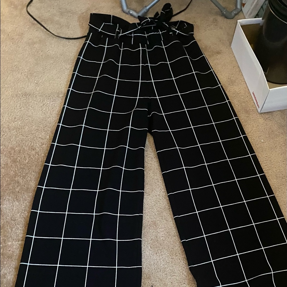 Black dress pants with matching belt.